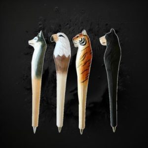 Assorted Hand Carved Wooden Animal Pens In Display